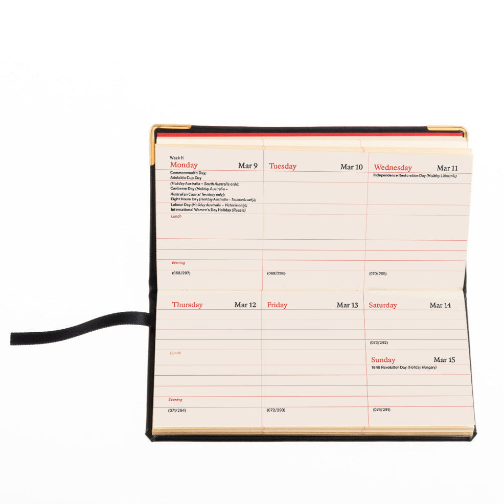 Weekly planner with a black strap on a white background